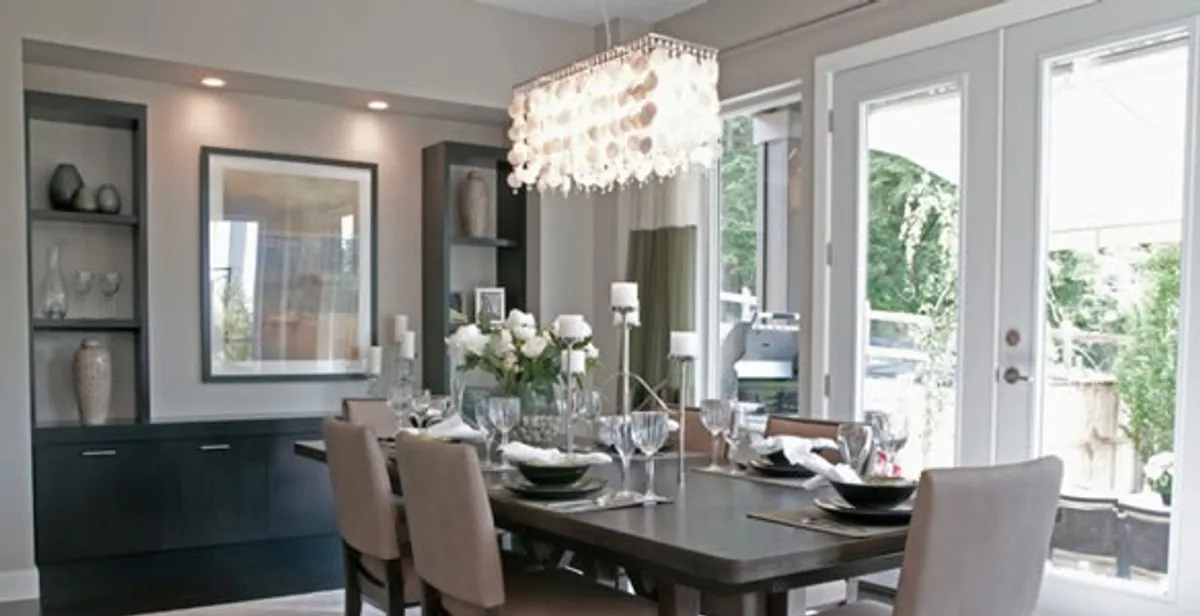 Elegant dining room chandelier installation above table in Chico, CA