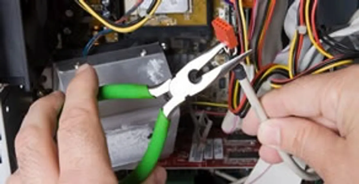 Licensed electrical contractor performing electrical repair with tools in Magalia, CA