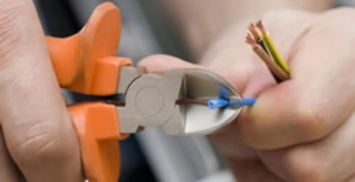 professional electrical services showing precise wire cutting by licensed electricians in Chico, CA